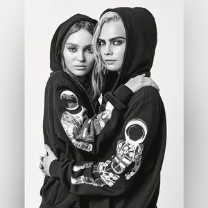 CHANEL Black Sweatshirt with Silver Astronaut Design